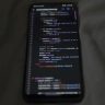 Close-up of a smartphone showing Python code on the display, showcasing coding and technology.