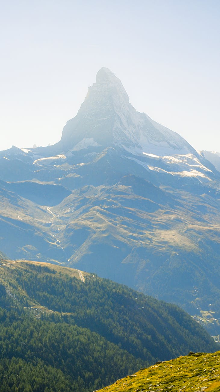 A breathtaking view of the Matterhorn mountain peak in Zermatt, Switzerland under a clear blue sky.