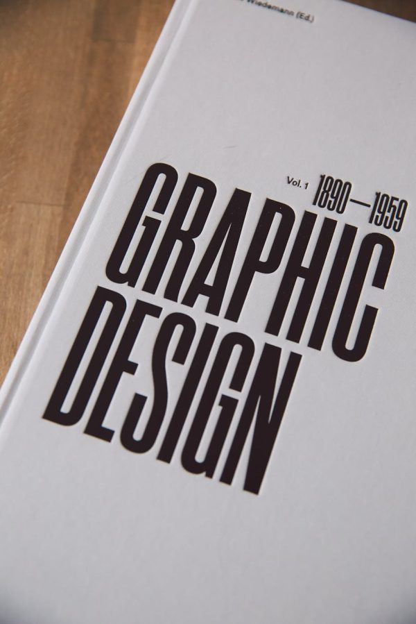 Close-up of a graphic design book cover highlighting years 1890-1959.